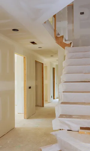 new-home interior construction of housing with drywall